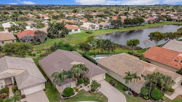 birds eye view of property with a residential view and a water view