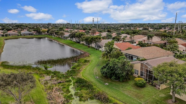 birds eye view of property with a water view and a residential view