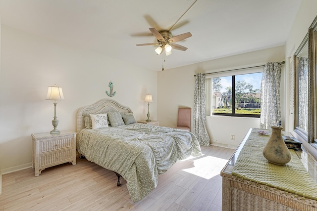 bedroom with ceiling fan and light wood-type flooring