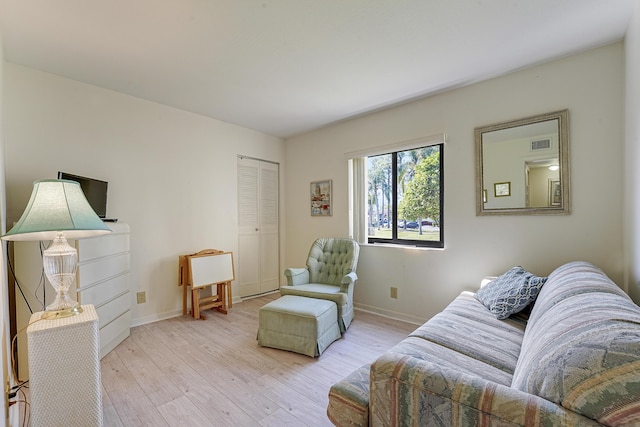 living room with light hardwood / wood-style flooring