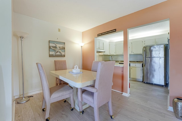 dining space featuring light hardwood / wood-style floors