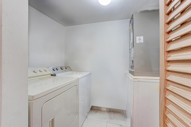 washroom featuring light tile patterned floors and independent washer and dryer