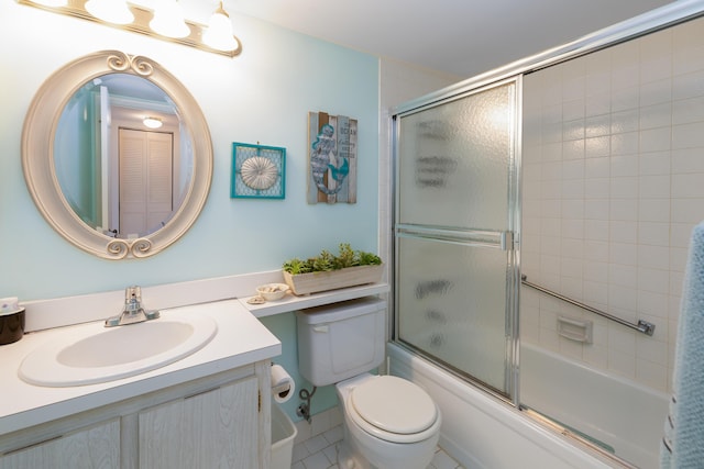 full bathroom featuring vanity, bath / shower combo with glass door, and toilet