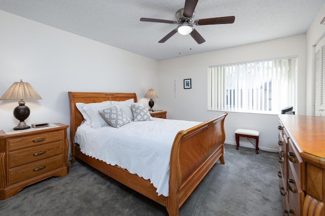 carpeted bedroom featuring ceiling fan, a closet, and a textured ceiling