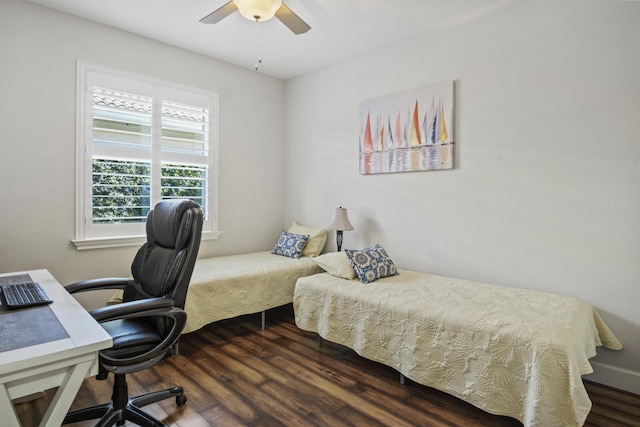 bedroom with ceiling fan and dark hardwood / wood-style floors