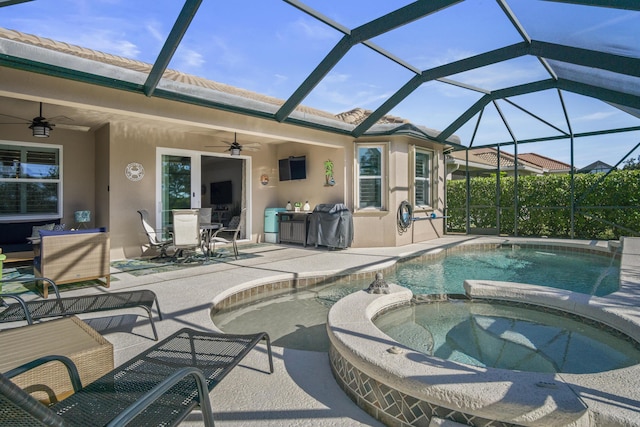 view of swimming pool featuring grilling area, a lanai, an in ground hot tub, ceiling fan, and a patio