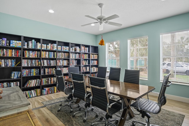 home office featuring ceiling fan, a textured ceiling, and light hardwood / wood-style flooring