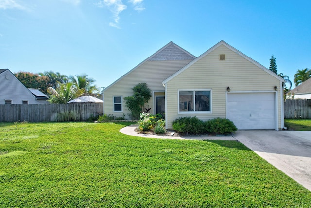 view of front of house with a garage and a front yard