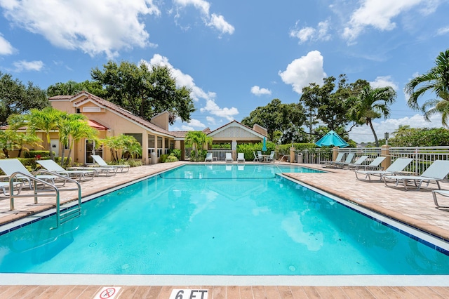 view of swimming pool featuring a patio