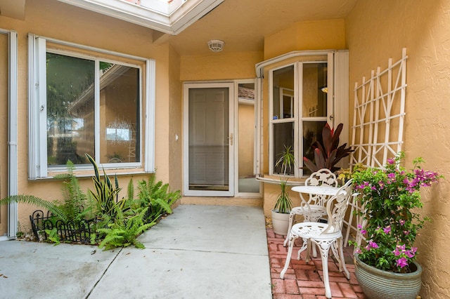 entrance to property with a patio