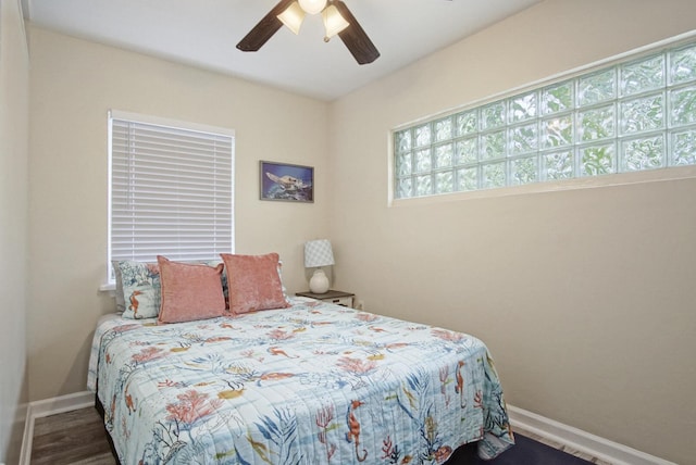 bedroom featuring ceiling fan and dark hardwood / wood-style floors