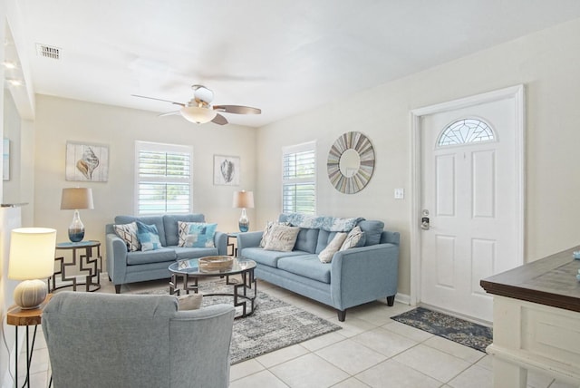 living room with ceiling fan and light tile patterned floors