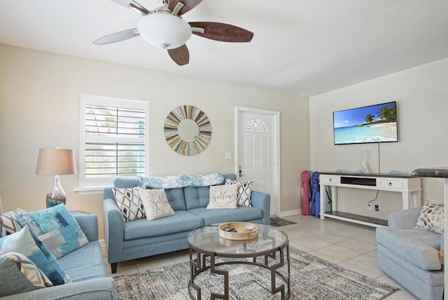 living room with light tile patterned flooring and ceiling fan