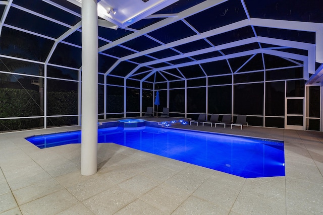 view of pool with an in ground hot tub, a lanai, and a patio area