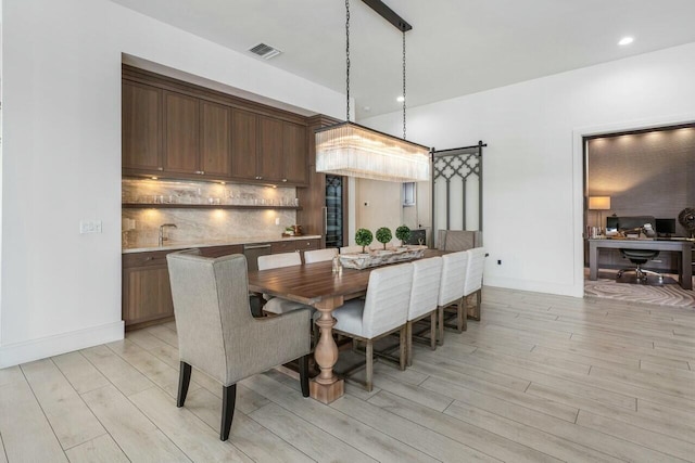 dining area with light wood-type flooring