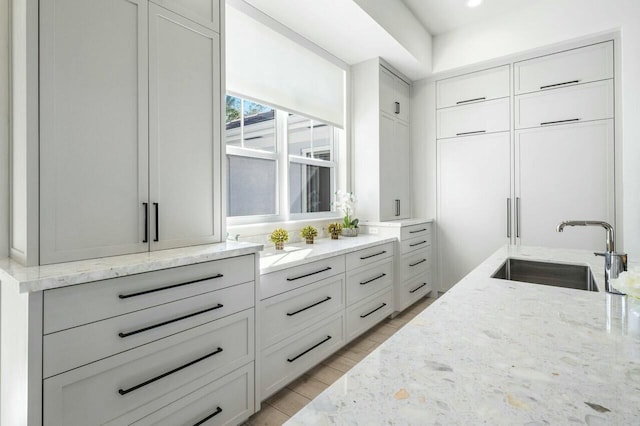 interior space featuring sink and light wood-type flooring