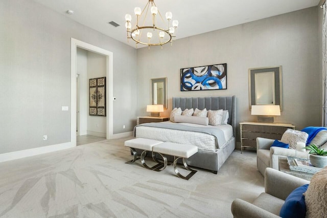 bedroom with an inviting chandelier and light colored carpet