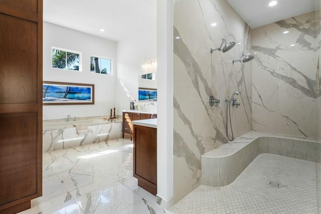 bathroom with vanity and separate shower and tub