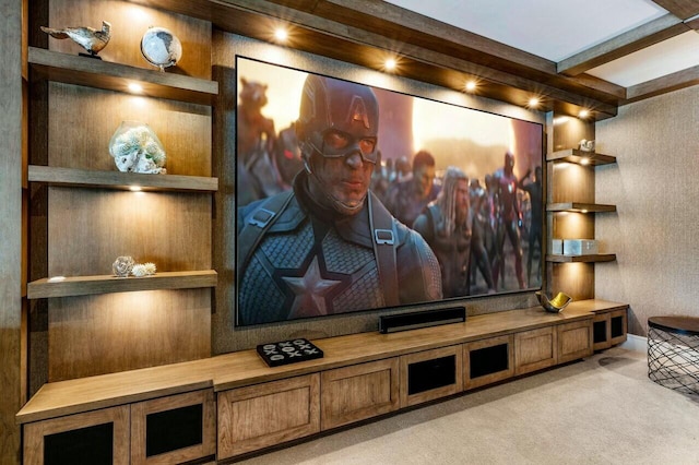 home theater room featuring light colored carpet and beam ceiling