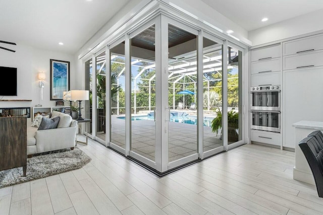 doorway to outside with light hardwood / wood-style flooring