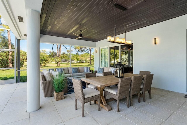 exterior space featuring ceiling fan and wooden ceiling