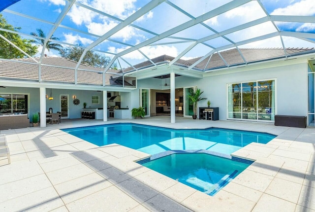 view of pool featuring area for grilling, a patio, ceiling fan, and glass enclosure