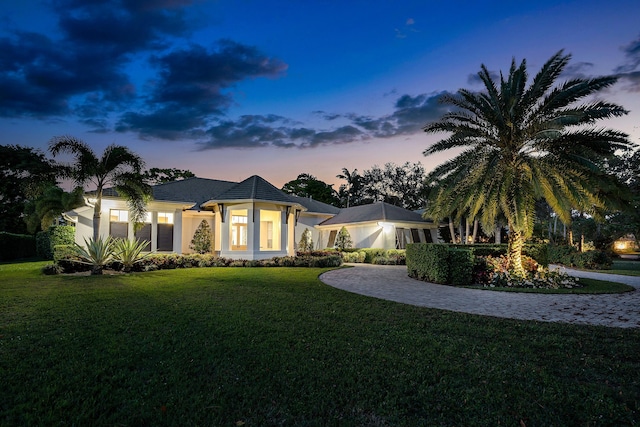 view of front of home with a lawn