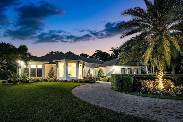 view of front of property with a yard