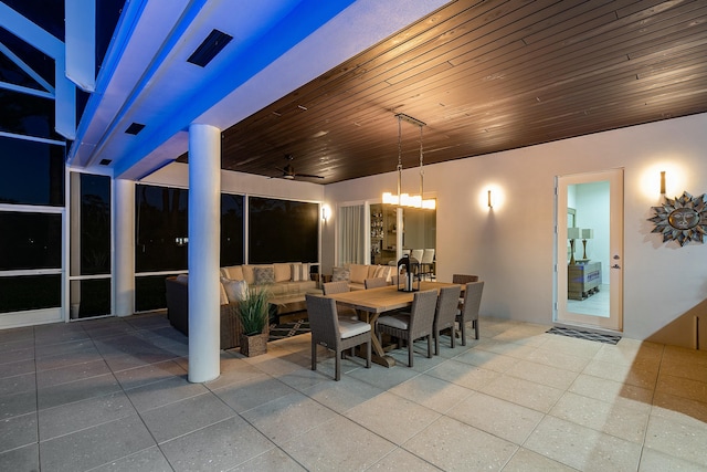 dining area with tile patterned floors, wooden ceiling, and an inviting chandelier