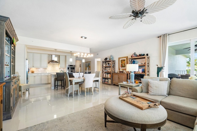 living room with ceiling fan and light tile patterned flooring