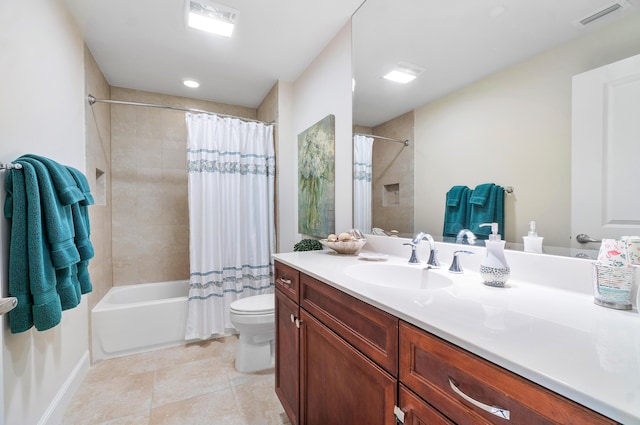 full bathroom with vanity, shower / tub combo, and toilet