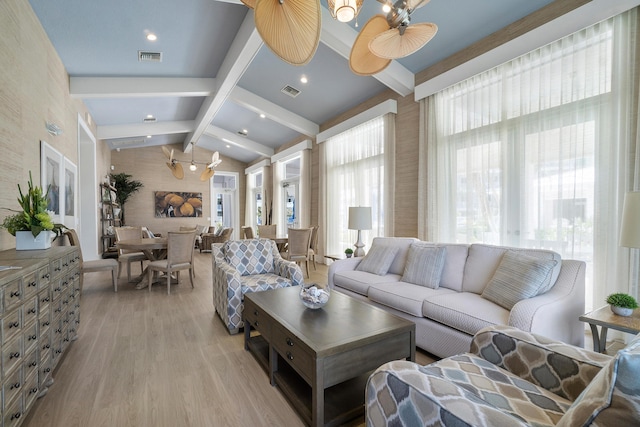 living room with lofted ceiling with beams, light hardwood / wood-style floors, and ceiling fan