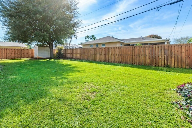 view of yard with a storage shed