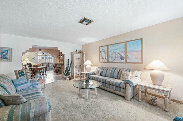 living room with a textured ceiling