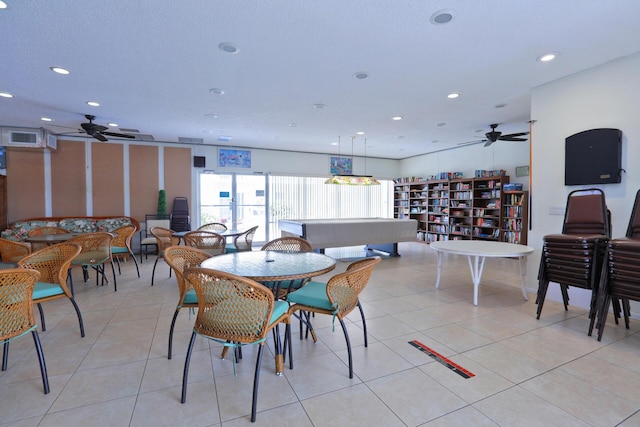 tiled dining space featuring ceiling fan