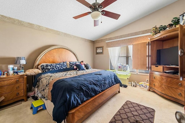 carpeted bedroom featuring vaulted ceiling, ceiling fan, and a textured ceiling