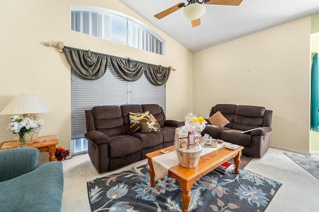 carpeted living room featuring lofted ceiling and ceiling fan