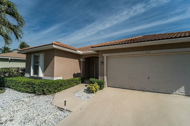 mediterranean / spanish-style house featuring a garage