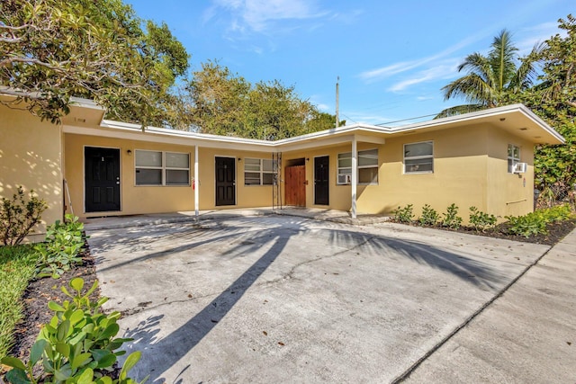 ranch-style house with stucco siding