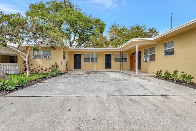 ranch-style home with stucco siding