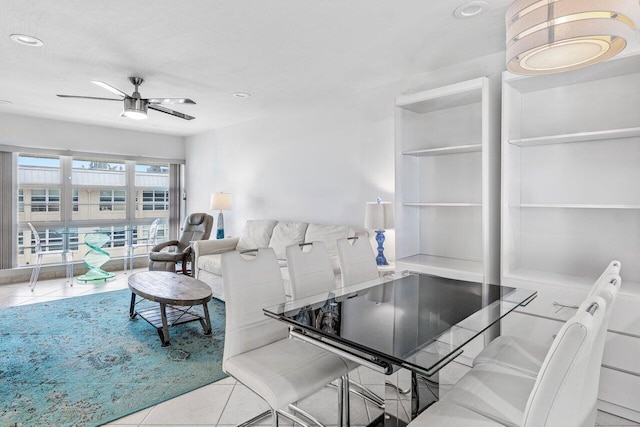 living room with light tile patterned flooring and ceiling fan