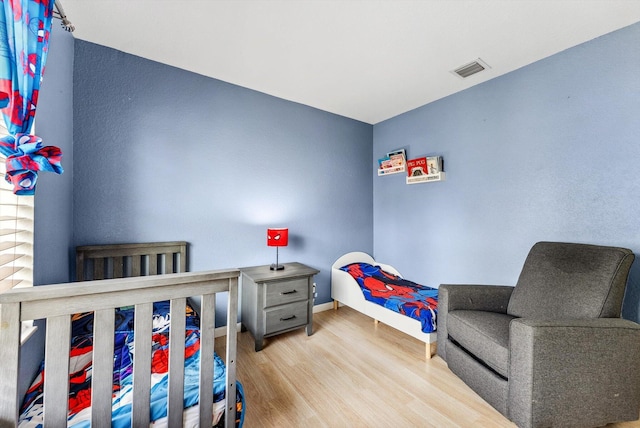 bedroom with light wood-type flooring