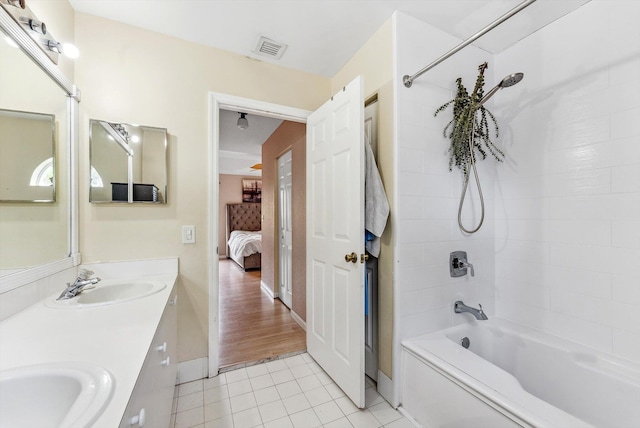 bathroom featuring shower / tub combination, vanity, and tile patterned floors