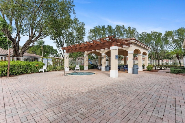 view of community with a patio and a pergola