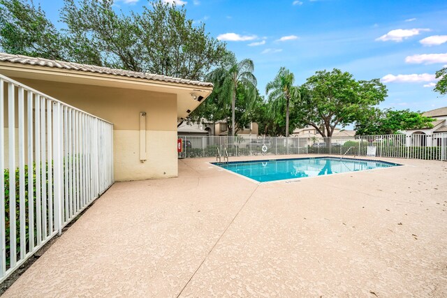 view of swimming pool with a patio