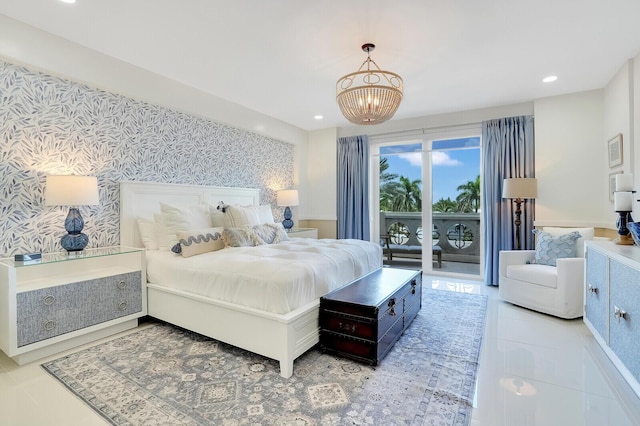 bedroom featuring access to outside and an inviting chandelier