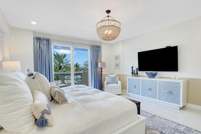 bedroom with access to outside and a notable chandelier