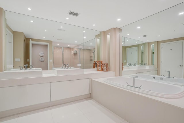 bathroom featuring vanity, tile patterned floors, and shower with separate bathtub