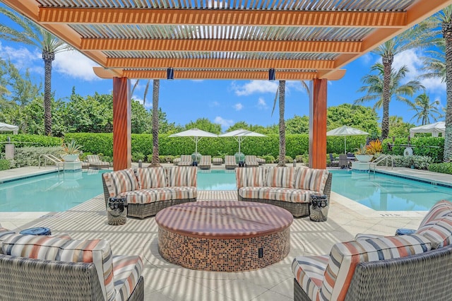 view of pool featuring an outdoor hangout area, a pergola, and a patio