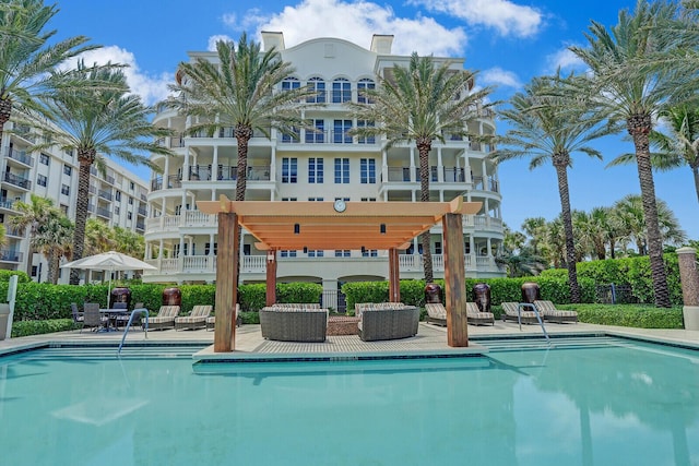 view of swimming pool featuring a pergola and a patio